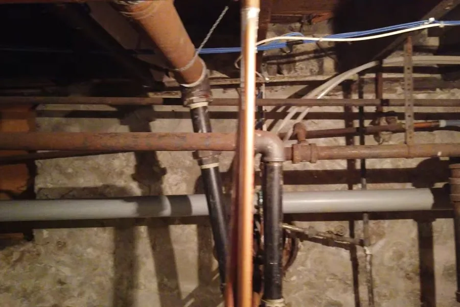 Basement drain pipe and plumbing lines during a plumbing service call in FireRock, Fountain Hills, AZ