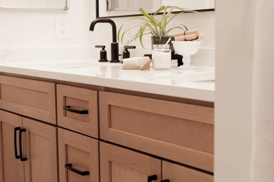 Bathroom vanity with sink and black faucet during a plumbing service call in Eagle Mountain, Fountain Hills, AZ