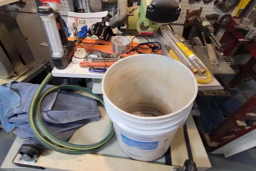 Bucket and cable tools for clearing a drain for drain cleaning & unclogging in Fountain Hills