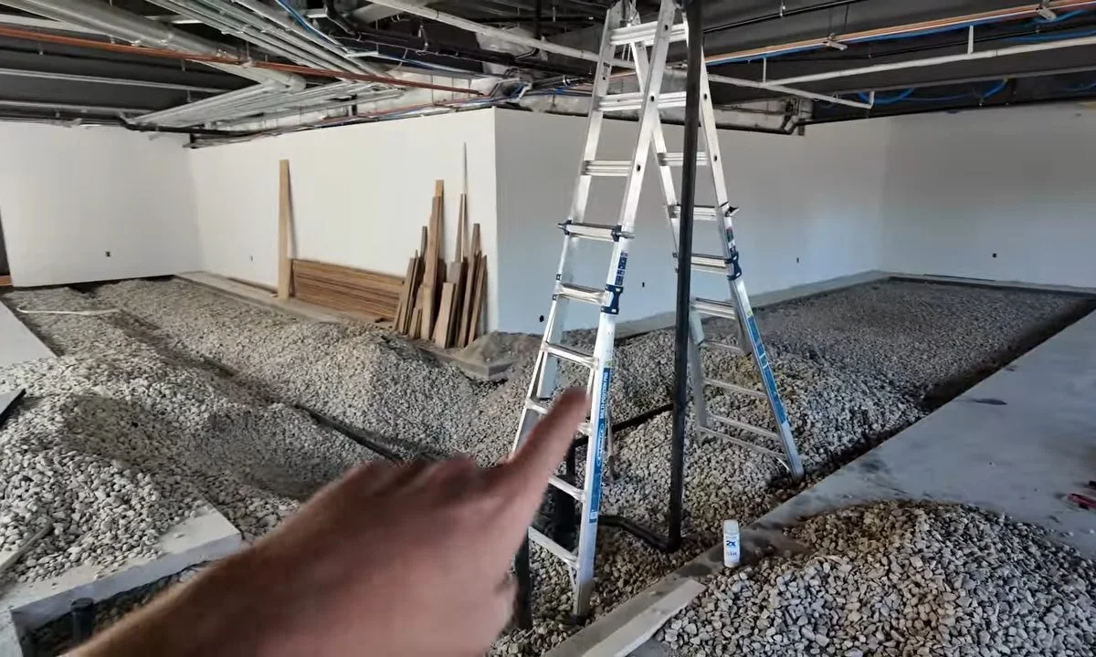 Commercial plumbing rough-in with ladder and piping during a plumbing service call in Apache Junction, AZ