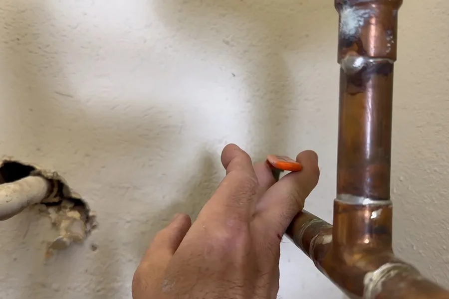 Copper pipe leak being marked on an interior wall for leak detection in Fountain Hills