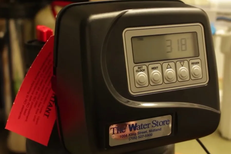 Digital water softener control panel during a plumbing service call in Downtown Fountain Hills, AZ