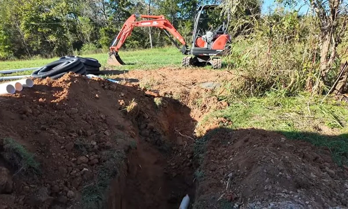 Excavator trenching for sewer line replacement for sewer line replacement in Fountain Hills