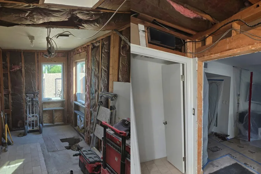 Full bathroom opened down to framing during a plumbing service call in Mesa, AZ