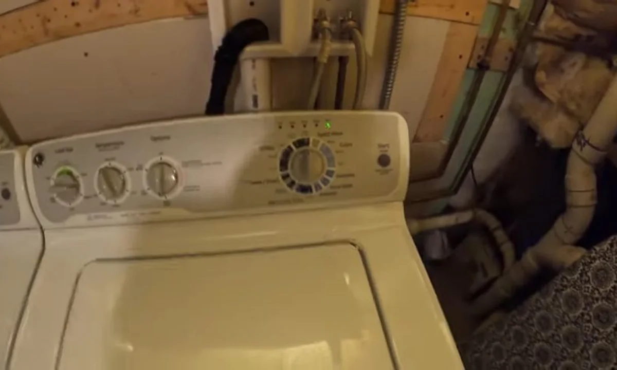 Laundry drain connection behind a washer during a plumbing service call in Eagle Mountain, Fountain Hills, AZ