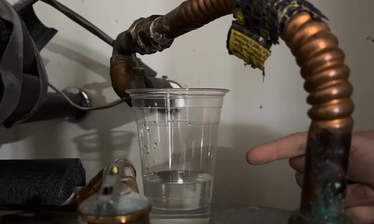 Leaking outdoor faucet inlet above a cup for hose bib & outdoor faucet repair in Fountain Hills
