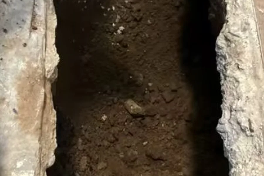 Narrow sewer trench opened through concrete for sewer line repair in Fountain Hills