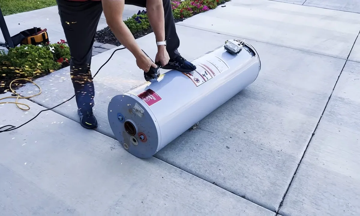 New water heater tank moved on a driveway during a plumbing service call in Tempe, AZ
