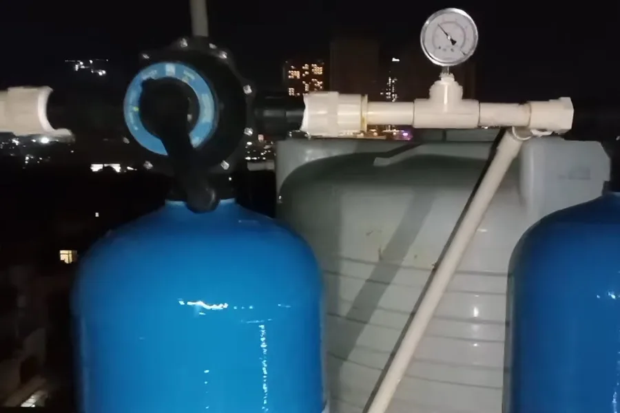 Pair of blue water softener tanks and gauges illustrating water softener sizing for fountain hills homes