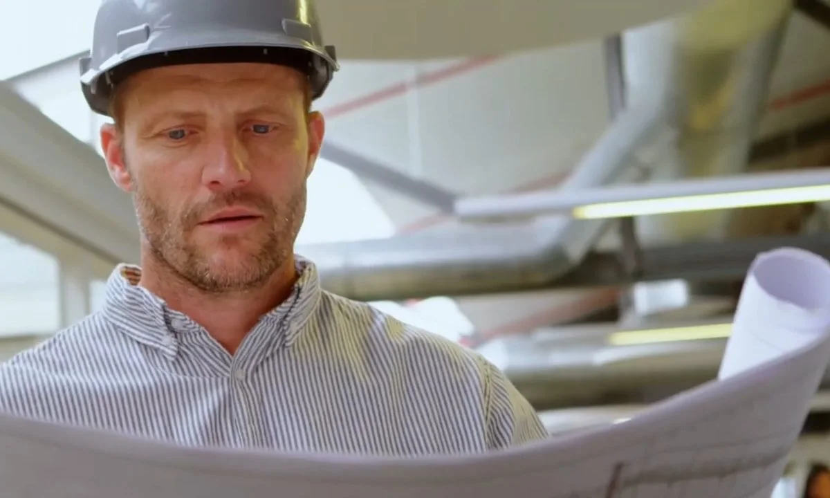 Plumber reviewing construction plans on site for Fountain Hills plumbing service