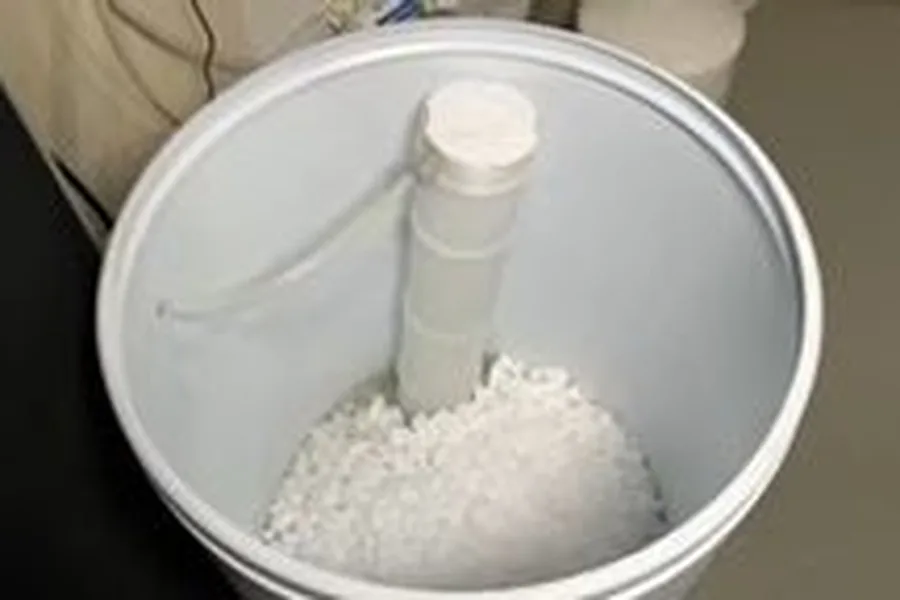 Salt pellets inside a softener brine tank during a plumbing service call in Eagle Mountain, Fountain Hills, AZ
