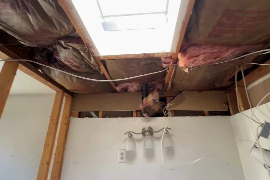Shower wall opened during bathroom demolition during a plumbing service call in Gold Canyon, AZ
