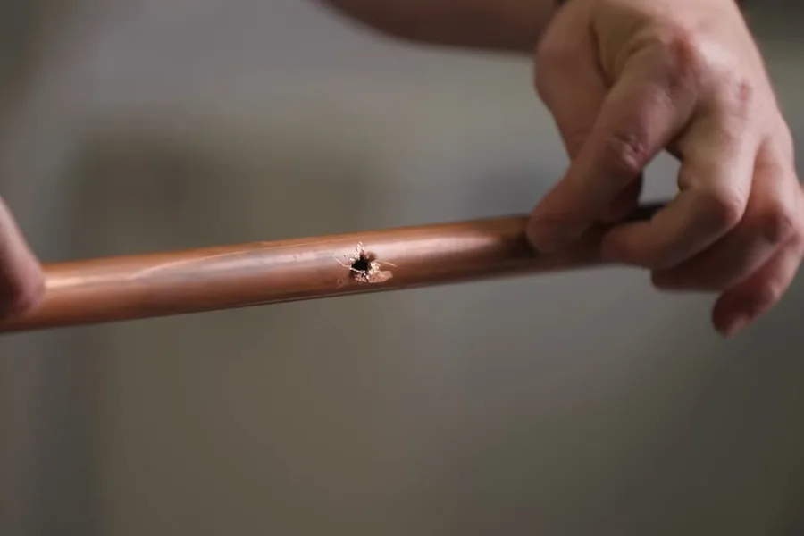 Small pinhole mark on a copper pipe for burst pipe repair in Fountain Hills