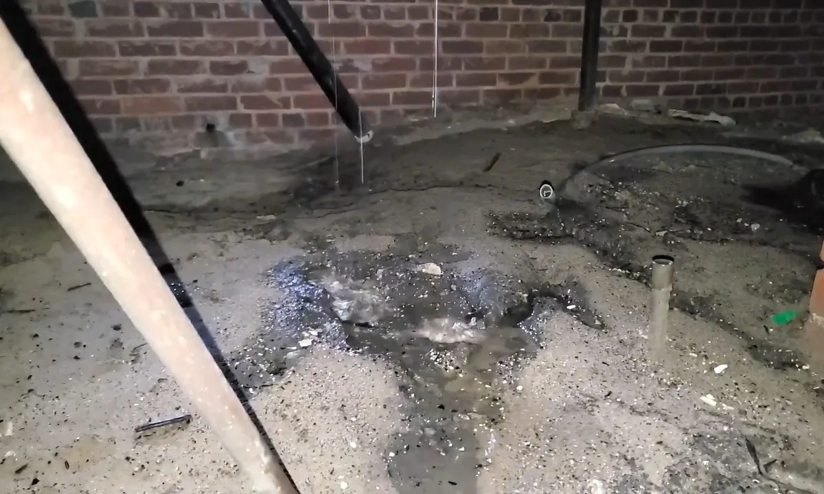 Staining and leak debris on a crawl space floor during a plumbing service call in Rio Verde, AZ