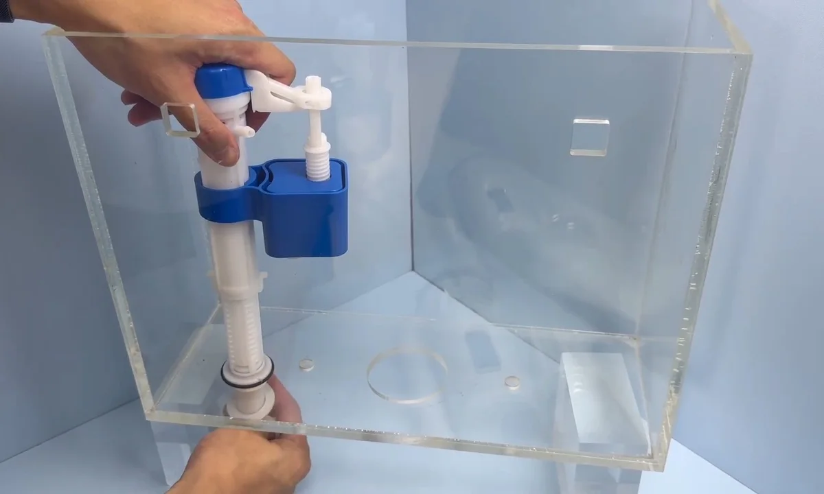 Toilet tank repair kit being installed for toilet repair & installation in Fountain Hills