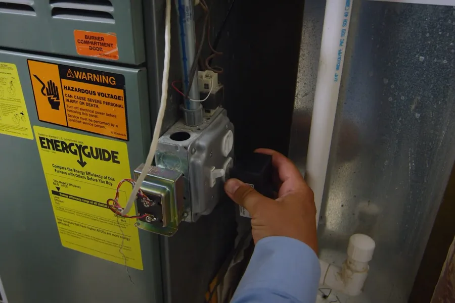 Water heater gas control valve being checked for gas line installation & repair in Fountain Hills