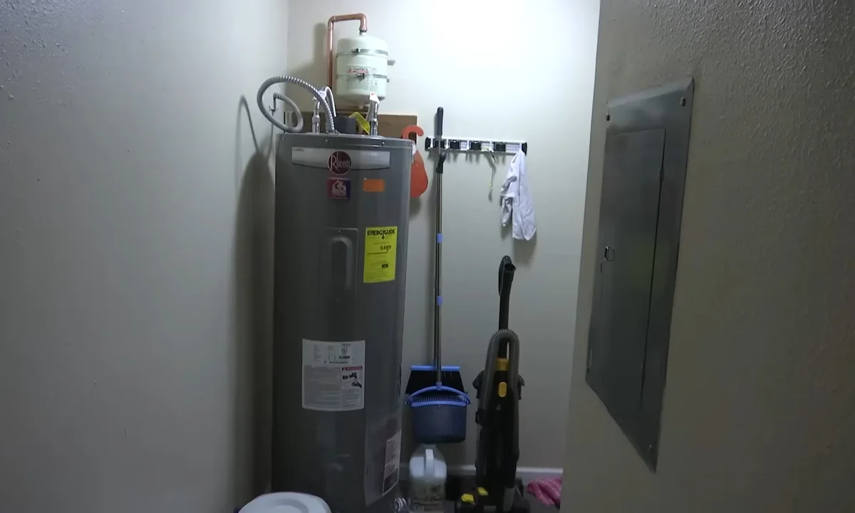 Water heater tank inside a utility closet for Fountain Hills plumbing maintenance guides
