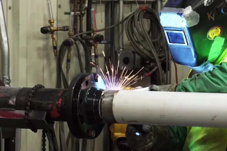 Welder repairing a large commercial pipe for commercial plumbing in Fountain Hills