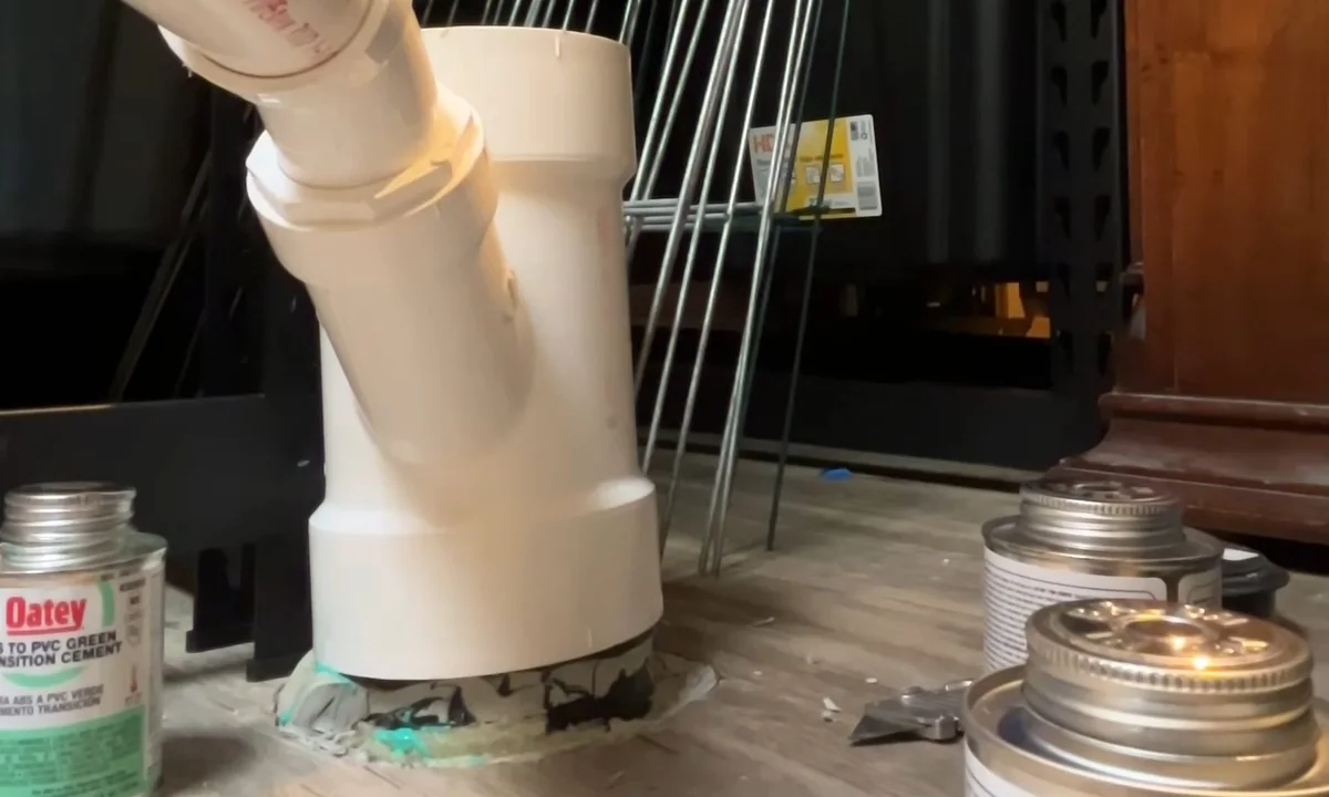 White disposal drain connection under a sink for garbage disposal repair & installation in Fountain Hills