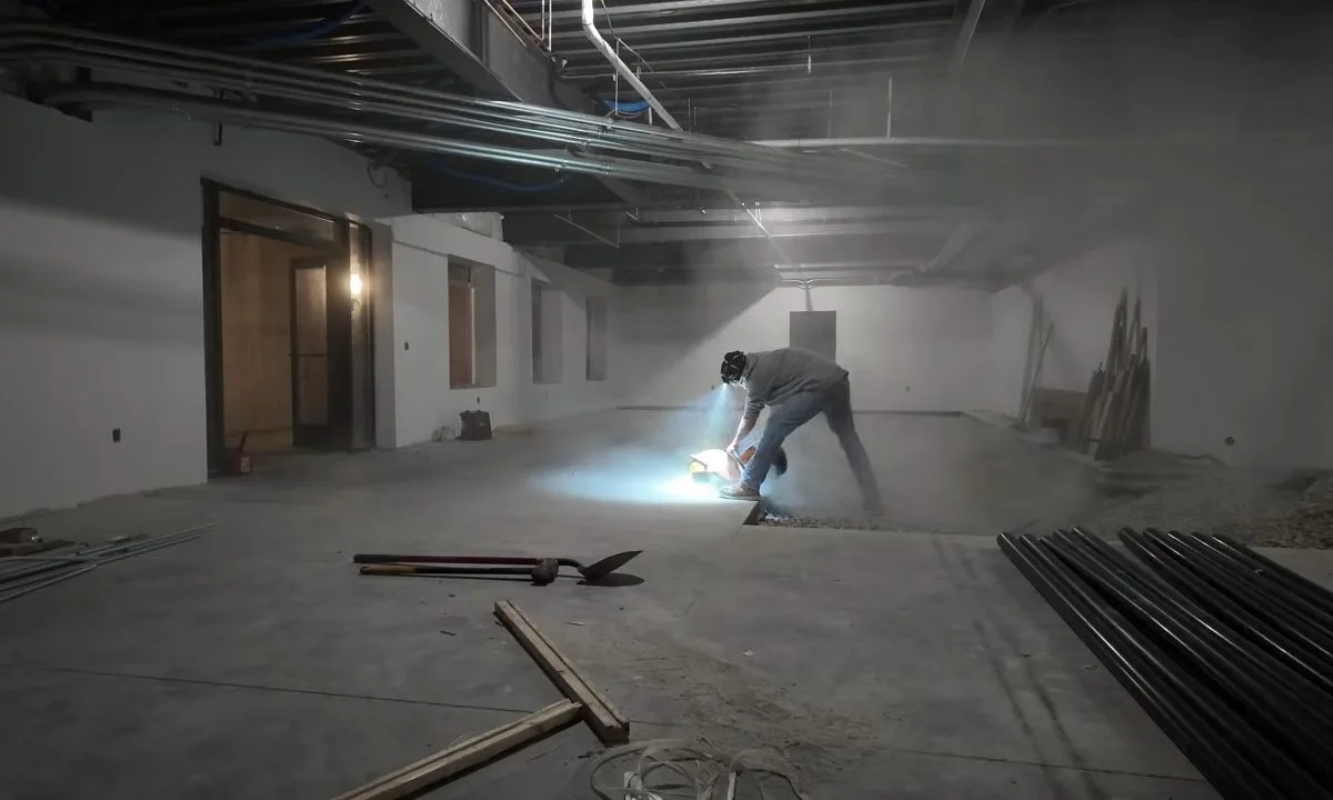 Worker cutting pipe in a commercial buildout during a plumbing service call in Adero Canyon, Fountain Hills, AZ
